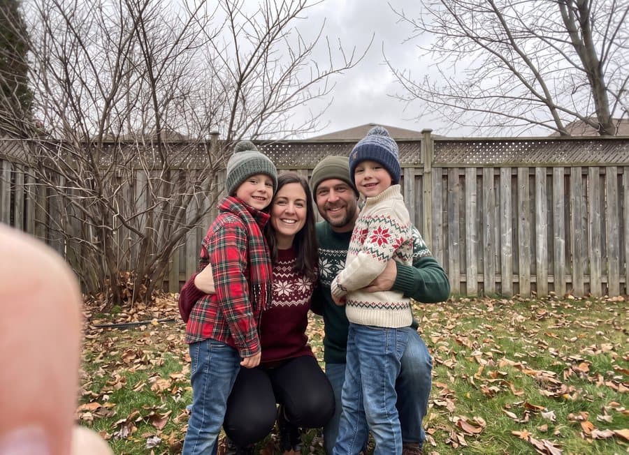 The same family photo with everyone in Christmas sweaters and plaid